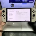 Nintendo Switch OLED trắng cũ màn hình cài đặt